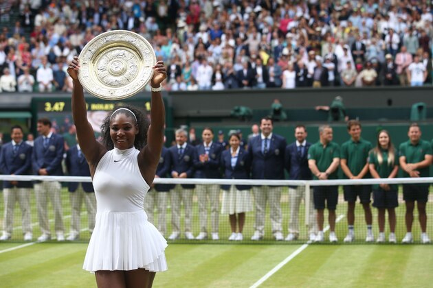 US player Serena Williams poses with the winner's trophy, the Venus Rosewater Dish, after her women's singles final victory over Germany's Angelique Kerber on the thirteenth day of the 2016 Wimbledon Championships at The All England Lawn Tennis Club in Wimbledon, southwest London, on July 9, 2016. / AFP / JUSTIN TALLIS / RESTRICTED TO EDITORIAL USE        (Photo credit should read JUSTIN TALLIS/AFP/Getty Images)