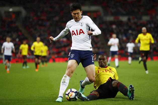 LONDON, ENGLAND - APRIL 30:  Christian Kabasele of Watford tackles Heung-Min Son of Tottenham Hotspur  during the Premier League match between Tottenham Hotspur and Watford at Wembley Stadium on April 30, 2018 in London, England.  (Photo by Julian Finney/Getty Images)
