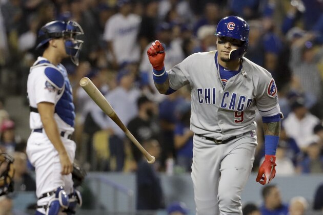 Chicago Cubs' Javier Baez tosses his bat after hitting a grand slam during the sixth inning of the team's baseball game against the Los Angeles Dodgers in Los Angeles, Tuesday, June 26, 2018. (AP Photo/Chris Carlson)