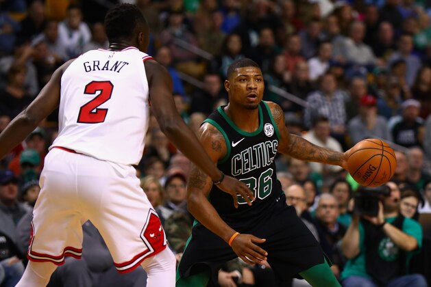 BOSTON, MA - DECEMBER 23:  Marcus Smart #36 of the Boston Celtics drives on Jerian Grant #2 of the Chicago Bulls during the second half of the game at TD Garden on December 23, 2017 in Boston, Massachusetts. NOTE TO USER: User expressly acknowledges and agrees that, by downloading and or using this photograph, User is consenting to the terms and conditions of the Getty Images License Agreement.  (Photo by Omar Rawlings/Getty Images)