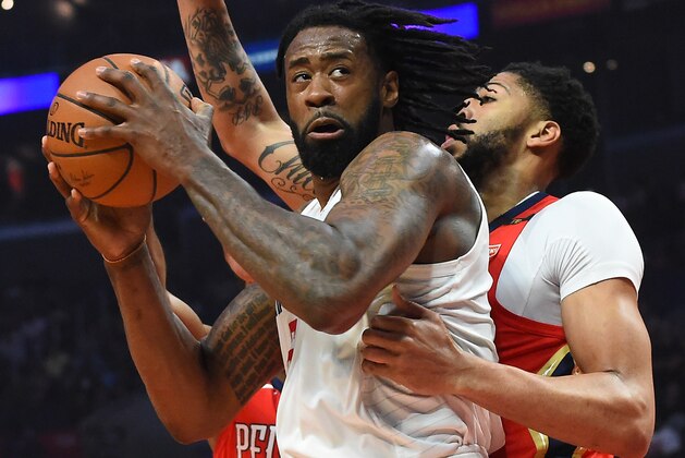 LOS ANGELES, CA - APRIL 09:  DeAndre Jordan #6 of the Los Angeles Clippers looks to shoot against Solomon Hill #44 and Anthony Davis #23 of the New Orleans Pelicans in the first half of the game at Staples Center on April 9, 2018 in Los Angeles, California.  NOTE TO USER: User expressly acknowledges and agrees that, by downloading and or using this photograph, User is consenting to the terms and conditions of the Getty Images License Agreement.  (Photo by Jayne Kamin-Oncea/Getty Images)