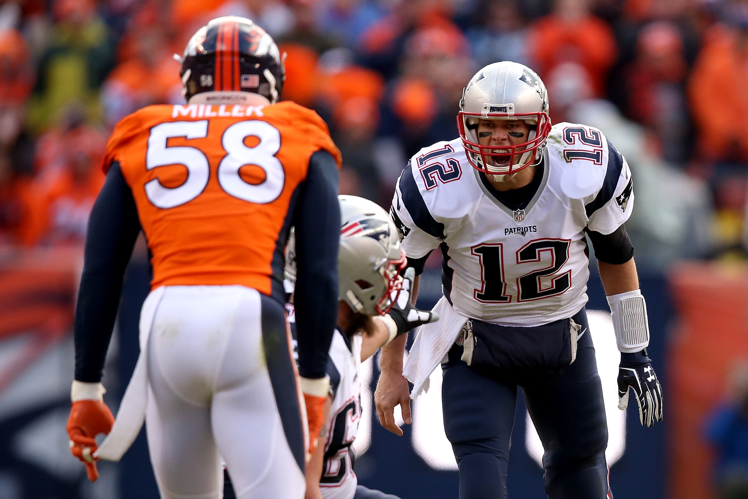 DENVER, CO - JANUARY 24: Tom Brady #12 of the New England Patriots looks on from the line of scrimmage in the second quarter against Von Miller #58 of the Denver Broncos in the AFC Championship game at Sports Authority Field at Mile High on January 24, 2016 in Denver, Colorado. (Photo by Doug Pensinger/Getty Images) DENVER, CO - JANUARY 24: Tom Brady #12 of the New England Patriots looks on from the line of scrimmage in the second quarter against Von Miller #58 of the Denver Broncos in the AFC Championship game at Sports Authority Field at Mile High on January 24, 2016 in Denver, Colorado. (Photo by Doug Pensinger/Getty Images)