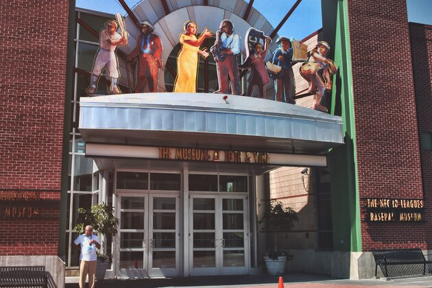 ** FILE ** Buck O'Neil addresses the media at the Negro Leagues Baseball Museum in Kansas City, Mo., in a Monday, Feb. 27, 2006, photo. O'Neil, baseball's charismatic Negro Leagues ambassador who barnstormed with Satchel Paige and inexplicably fell one vote shy of the Hall of Fame, died Friday, Oct. 6, 2006.. He was 94.(AP Photo/Chris Cummins, file)