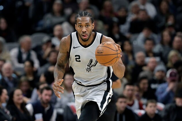 FILE - In this Jan. 13, 2018, file photo, San Antonio Spurs forward Kawhi Leonard (2) moves the ball up court during the second half of an NBA basketball game against the Denver Nuggets, in San Antonio. General manager R.C. Buford acknowledges star forward Kawhi Leonard is unhappy with the Spurs. He remains optimistic the relationship can be salvaged. (AP Photo/Eric Gay, File)