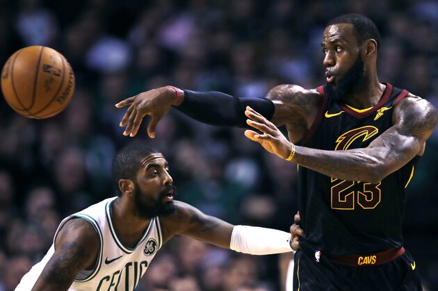 Cleveland Cavaliers forward LeBron James (23) passes the ball as Boston Celtics guard Kyrie Irving defends during the second quarter of an NBA basketball game in Boston, Wednesday, Jan. 3, 2018. (AP Photo/Charles Krupa)