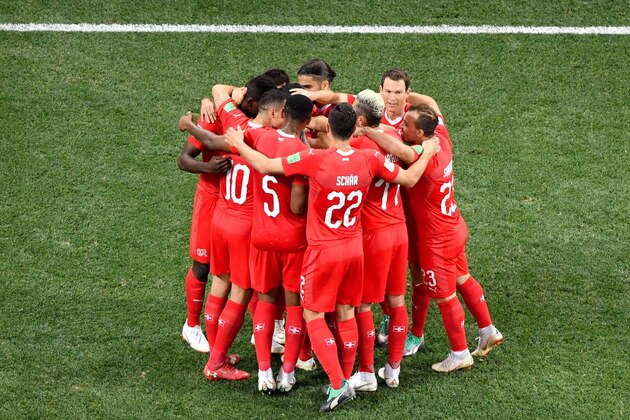 Switzerland's midfielder Blerim Dzemaili (hidden) celebrates with teammates  after scoring the opening goal during the Russia 2018 World Cup Group E football match between Switzerland and Costa Rica at the Nizhny Novgorod Stadium in Nizhny Novgorod on June 27, 2018. (Photo by ANTONIN THUILLIER / AFP) / RESTRICTED TO EDITORIAL USE - NO MOBILE PUSH ALERTS/DOWNLOADS        (Photo credit should read ANTONIN THUILLIER/AFP/Getty Images)