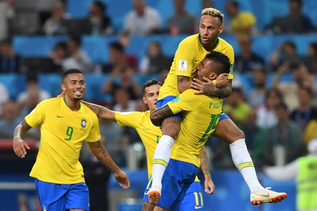 Brazil's midfielder Paulinho (R) celebrates with teammates Brazil's forward Neymar (top), Brazil's forward Gabriel Jesus (L) and Brazil's forward Philippe Coutinho after scoring during the Russia 2018 World Cup Group E football match between Serbia and Brazil at the Spartak Stadium in Moscow on June 27, 2018. (Photo by Francisco LEONG / AFP) / RESTRICTED TO EDITORIAL USE - NO MOBILE PUSH ALERTS/DOWNLOADS        (Photo credit should read FRANCISCO LEONG/AFP/Getty Images)