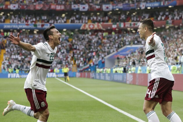 Mexico's Javier Hernandez, right, celebrates with teammate Hirving Lozano after scoring his side's second goal during the group F match between Mexico and South Korea at the 2018 soccer World Cup in the Rostov Arena in Rostov-on-Don, Russia, Saturday, June 23, 2018. (AP Photo/Lee Jin-man)