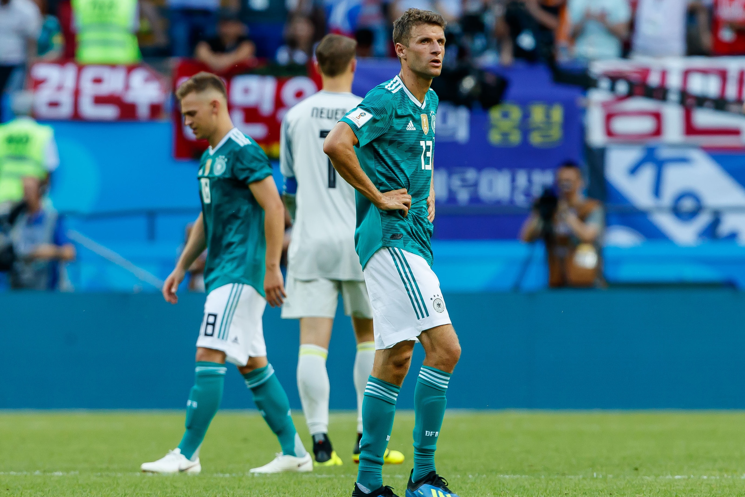KAZAN, RUSSIA - JUNE 27: Joshua Kimmich of Germany, Thomas Mueller of Germany and Goalkeeper Manuel Neuer of Germany look dejected after the 2018 FIFA World Cup Russia group F match between Korea Republic and Germany at Kazan Arena on June 27, 2018 in Kazan, Russia. (Photo by TF-Images/Getty Images)