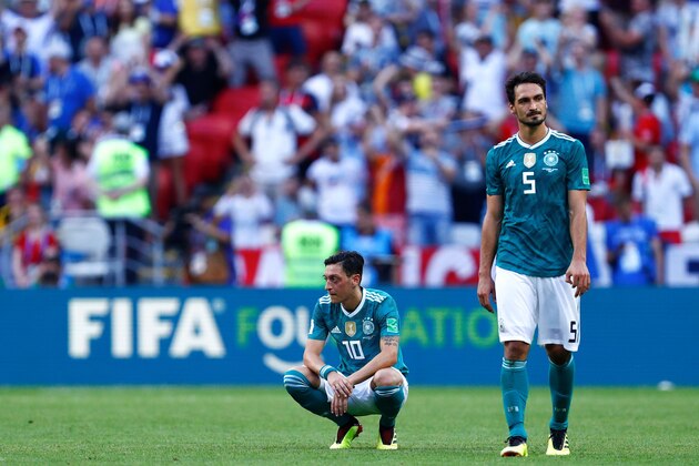 TOPSHOT - Germany's defender Mats Hummels (R) and Germany's midfielder Mesut Ozil react to their defeat during the Russia 2018 World Cup Group F football match between South Korea and Germany at the Kazan Arena in Kazan on June 27, 2018. (Photo by BENJAMIN CREMEL / AFP) / RESTRICTED TO EDITORIAL USE - NO MOBILE PUSH ALERTS/DOWNLOADS        (Photo credit should read BENJAMIN CREMEL/AFP/Getty Images)