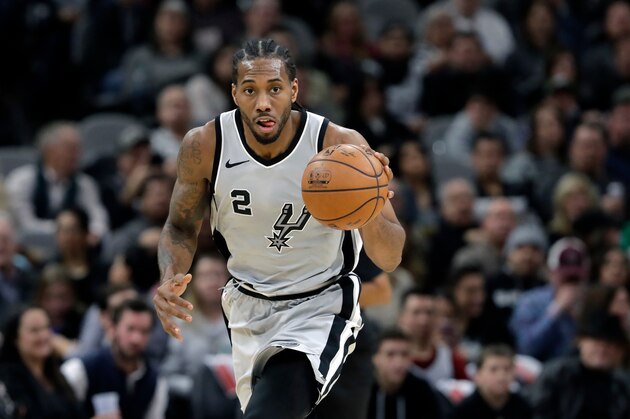 FILE - In this Jan. 13, 2018, file photo, San Antonio Spurs forward Kawhi Leonard (2) moves the ball up court during the second half of an NBA basketball game against the Denver Nuggets, in San Antonio. General manager R.C. Buford acknowledges star forward Kawhi Leonard is unhappy with the Spurs. He remains optimistic the relationship can be salvaged. (AP Photo/Eric Gay, File)