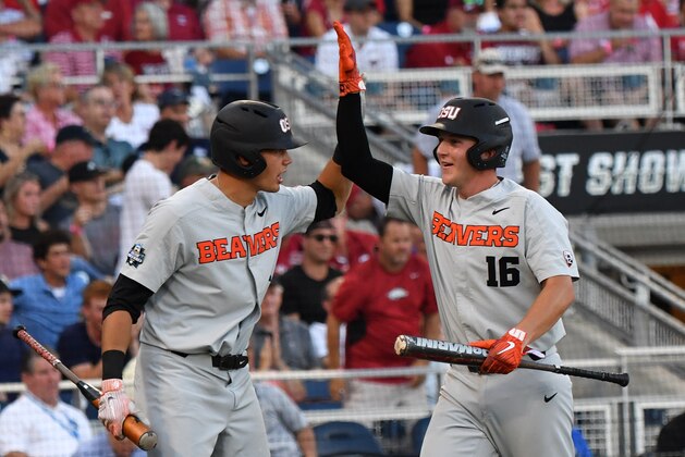 Omaha, NE - JUNE 27:  Catcher Zak Taylor #16 of the Oregon State Beavers celebrates after scoring a run in the fifth inning against the Arkansas Razorbacks during game two of the College World Series Championship Series on June 27, 2018 at TD Ameritrade Park in Omaha, Nebraska.  (Photo by Peter Aiken/Getty Images)