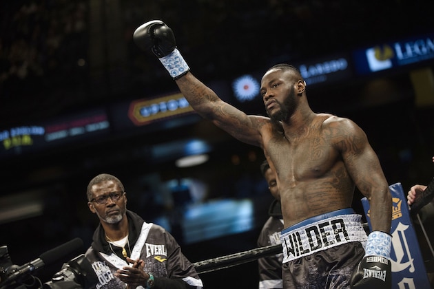 FILE - In this Feb. 25, 2017, file photo, boxer Deontay Wilder raises his glove before his heavyweight title fight against Gerald Washington in Birmingham, Ala. Undefeated heavyweights Deontay Wilder and Luis Ortiz are scheduled to fight at Brooklyn's Barclays Center in New York on Nov. 4, 2017. (AP Photo/Albert Cesare, File) FILE - In this Feb. 25, 2017, file photo, boxer Deontay Wilder raises his glove before his heavyweight title fight against Gerald Washington in Birmingham, Ala. Undefeated heavyweights Deontay Wilder and Luis Ortiz are scheduled to fight at Brooklyn's Barclays Center in New York on Nov. 4, 2017. (AP Photo/Albert Cesare, File)