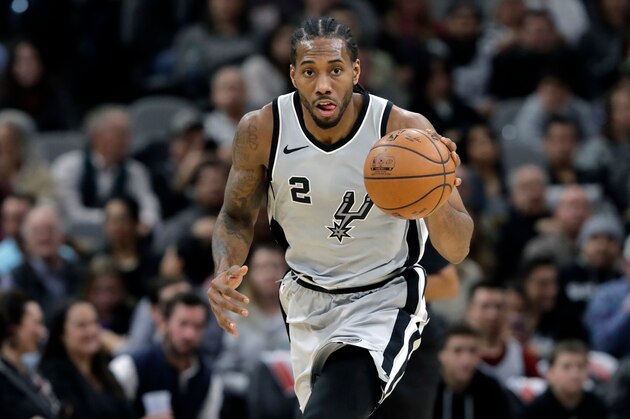 FILE - In this Jan. 13, 2018, file photo, San Antonio Spurs forward Kawhi Leonard (2) moves the ball up court during the second half of an NBA basketball game against the Denver Nuggets, in San Antonio. The absolute unwillingness to answer certain questions is part of the San Antonio Spurs' mystique. The Spurs just don't share much. So there is some unmistakable irony here that when it comes to the obviously fractured relationship between San Antonio and Kawhi Leonard, it's the Spurs who are the ones frustrated by the lack of answers. (AP Photo/Eric Gay, File)