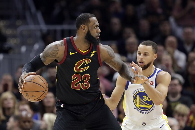 Cleveland Cavaliers' LeBron James is defended by Golden State Warriors' Stephen Curry in the first half of Game 3 of basketball's NBA Finals, Wednesday, June 6, 2018, in Cleveland. (AP Photo/Tony Dejak)