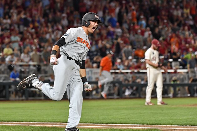 Omaha, NE - JUNE 27:  Outfielder Trevor Larnach #11 of the Oregon State Beavers reacts after hitting a two run home run to give the Beavers a 5-3 lead in the ninth inning against the Arkansas Razorbacks during game two of the College World Series Championship Series on June 27, 2018 at TD Ameritrade Park in Omaha, Nebraska.  (Photo by Peter Aiken/Getty Images)