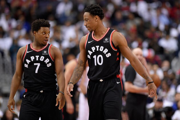 Toronto Raptors guard DeMar DeRozan (10) talks with guard Kyle Lowry (7) during the second half of Game 3 of an NBA basketball first-round playoff series against the Washington Wizards, Friday, April 20, 2018, in Washington. The Wizards won 122-103. (AP Photo/Nick Wass)