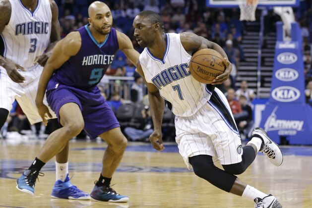 Orlando Magic's Ben Gordon (7) drives around Charlotte Hornets' Gerald Henderson (9) during the second half of an NBA basketball game, Sunday, March 1, 2015, in Orlando, Fla. Charlotte won 98-83. (AP Photo/John Raoux)