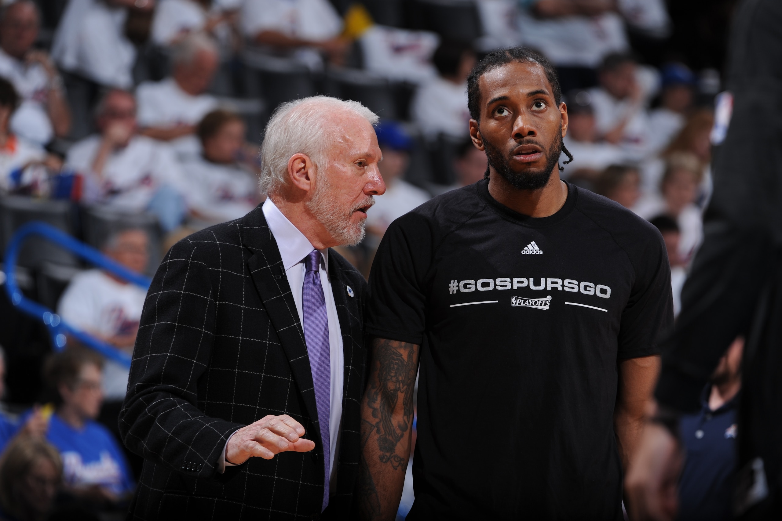 SSAN ANTONIO, TX - MAY 6: Gregg Popovich coaches Kawhi Leonard #2 of the San Antonio Spurs during the game against the Oklahoma City Thunder in Game Three of the Western Conference Semifinals of the 2016 NBA Playoffs on May 6, 2016 at the AT&T Center in San Antonio, Texas. NOTE TO USER: User expressly acknowledges and agrees that, by downloading and or using this photograph, user is consenting to the terms and conditions of the Getty Images License Agreement. Mandatory Copyright Notice: Copyright 2016 NBAE (Photo by Garrett W. Ellwood/NBAE via Getty Images) SSAN ANTONIO, TX - MAY 6: Gregg Popovich coaches Kawhi Leonard #2 of the San Antonio Spurs during the game against the Oklahoma City Thunder in Game Three of the Western Conference Semifinals of the 2016 NBA Playoffs on May 6, 2016 at the AT&T Center in San Antonio, Texas. NOTE TO USER: User expressly acknowledges and agrees that, by downloading and or using this photograph, user is consenting to the terms and conditions of the Getty Images License Agreement. Mandatory Copyright Notice: Copyright 2016 NBAE (Photo by Garrett W. Ellwood/NBAE via Getty Images)
