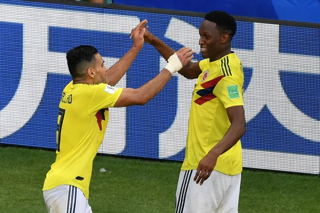 Colombia's defender Yerry Mina (R) celebrates with Colombia's forward Falcao (L) after scoring a goal during the Russia 2018 World Cup Group H football match between Senegal and Colombia at the Samara Arena in Samara on June 28, 2018. (Photo by Fabrice COFFRINI / AFP) / RESTRICTED TO EDITORIAL USE - NO MOBILE PUSH ALERTS/DOWNLOADS        (Photo credit should read FABRICE COFFRINI/AFP/Getty Images)