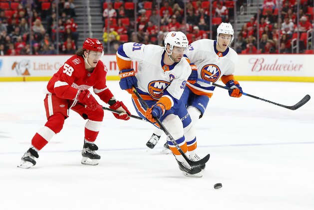 New York Islanders center John Tavares (91) carries the puck against the Detroit Red Wings in the first period of an NHL hockey game Saturday, April 7, 2018, in Detroit. (AP Photo/Paul Sancya)