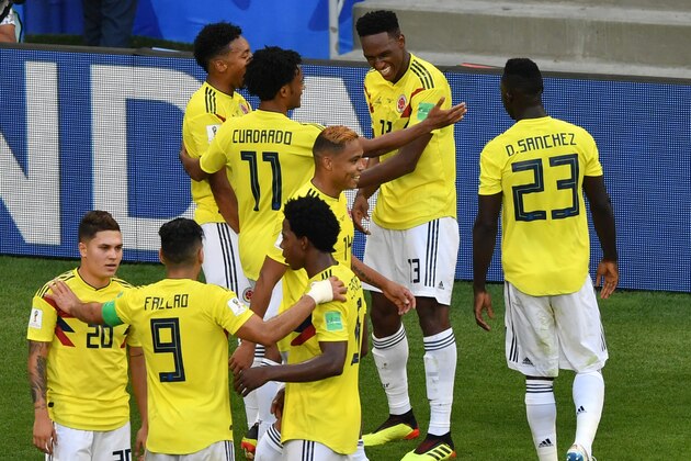 Colombia's defender Yerry Mina (rear R) celebrates with teammates after scoring a goal during the Russia 2018 World Cup Group H football match between Senegal and Colombia at the Samara Arena in Samara on June 28, 2018. (Photo by Fabrice COFFRINI / AFP) / RESTRICTED TO EDITORIAL USE - NO MOBILE PUSH ALERTS/DOWNLOADS        (Photo credit should read FABRICE COFFRINI/AFP/Getty Images)