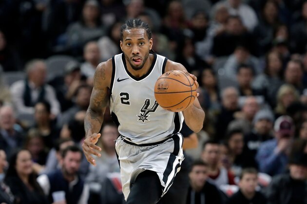 FILE - In this Jan. 13, 2018, file photo, San Antonio Spurs forward Kawhi Leonard (2) moves the ball up court during the second half of an NBA basketball game against the Denver Nuggets, in San Antonio. General manager R.C. Buford acknowledges star forward Kawhi Leonard is unhappy with the Spurs. He remains optimistic the relationship can be salvaged. (AP Photo/Eric Gay, File)