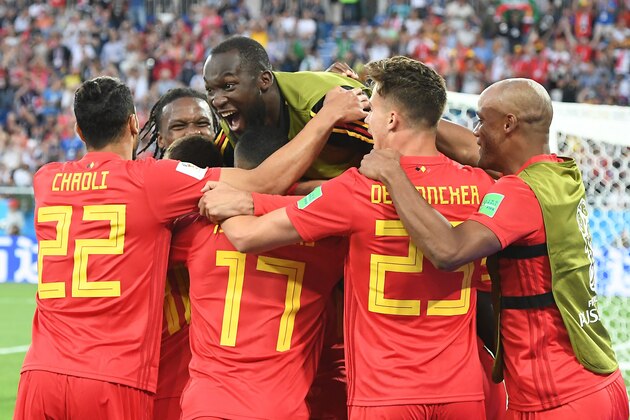 TOPSHOT - Belgium's forward Adnan Januzaj (hidden) celebrates scoring the opening goal with his teammates including forward Romelu Lukaku (top) during the Russia 2018 World Cup Group G football match between England and Belgium at the Kaliningrad Stadium in Kaliningrad on June 28, 2018. (Photo by Attila KISBENEDEK / AFP) / RESTRICTED TO EDITORIAL USE - NO MOBILE PUSH ALERTS/DOWNLOADS        (Photo credit should read ATTILA KISBENEDEK/AFP/Getty Images)