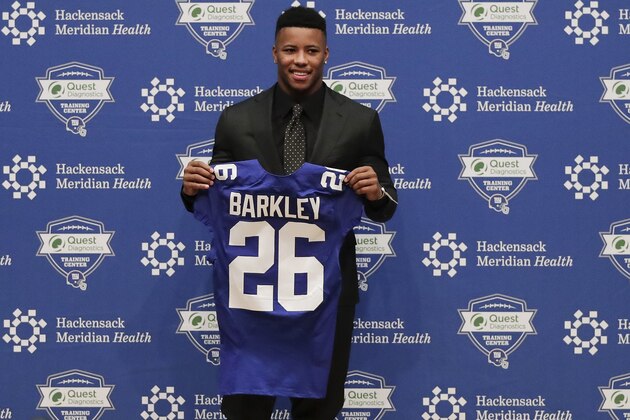 Running back Saquon Barkley poses for photos during a news conference, Saturday, April 28, 2018, in East Rutherford, N.J. Barkley was selected as the number two overall pick in the NFL football draft by the New York Giants. (AP Photo/Julie Jacobson)
