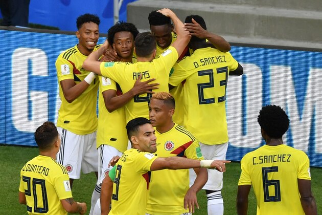 Colombia's defender Yerry Mina (rear C) celebrates with teammates after scoring a goal during the Russia 2018 World Cup Group H football match between Senegal and Colombia at the Samara Arena in Samara on June 28, 2018. (Photo by Fabrice COFFRINI / AFP) / RESTRICTED TO EDITORIAL USE - NO MOBILE PUSH ALERTS/DOWNLOADS        (Photo credit should read FABRICE COFFRINI/AFP/Getty Images)