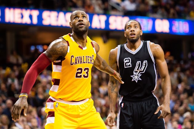 CLEVELAND, OH - JANUARY 30: LeBron James #23 of the Cleveland Cavaliers and Kawhi Leonard #2 of the San Antonio Spurs wait for a rebound during the second half at Quicken Loans Arena on January 30, 2016 in Cleveland, Ohio. The Cavaliers defeated the Spurs 117-103. NOTE TO USER: User expressly acknowledges and agrees that, by downloading and/or using this photograph, user is consenting to the terms and conditions of the Getty Images License Agreement. Mandatory copyright notice. (Photo by Jason Miller/Getty Images)
