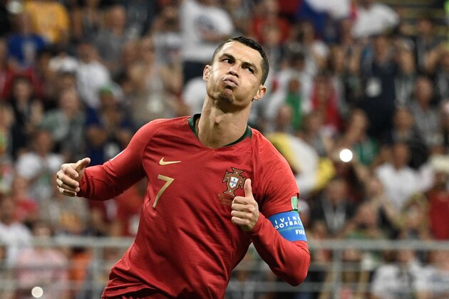 TOPSHOT - Portugal's forward Cristiano Ronaldo reacts during the Russia 2018 World Cup Group B football match between Iran and Portugal at the Mordovia Arena in Saransk on June 25, 2018. (Photo by Filippo MONTEFORTE / AFP) / RESTRICTED TO EDITORIAL USE - NO MOBILE PUSH ALERTS/DOWNLOADS        (Photo credit should read FILIPPO MONTEFORTE/AFP/Getty Images)