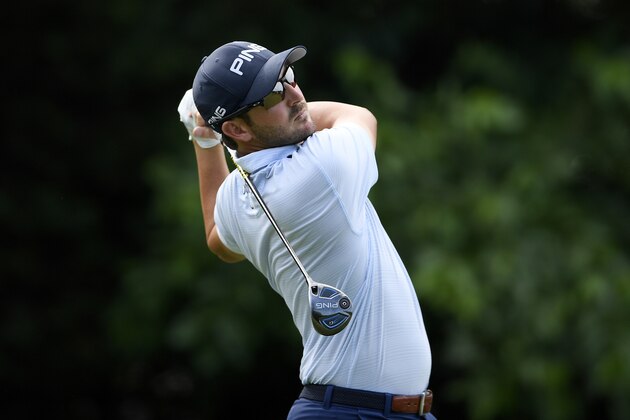 Andrew Landry watches his tee shot from the 16th tee during the first round of the Quicken Loans National golf tournament, Thursday, June 28, 2018, in Potomac, Md. (AP Photo/Nick Wass)