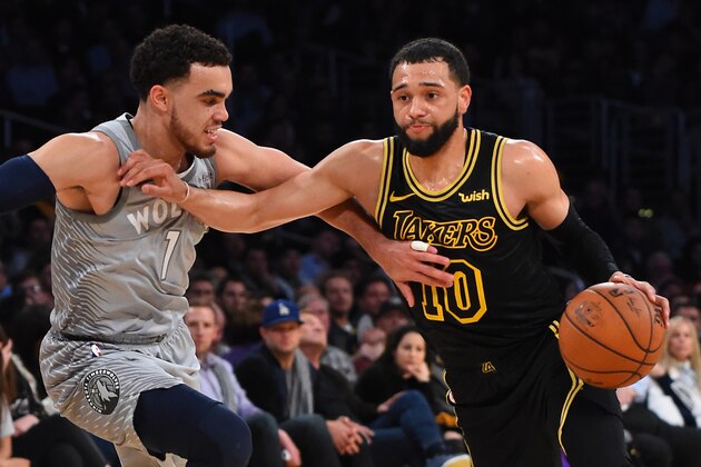 LOS ANGELES, CA - APRIL 06:  Tyus Jones #1 of the Minnesota Timberwolves guards Tyler Ennis #10 of the Los Angeles Lakers as he drives to the basket in the second half of the game at Staples Center on April 6, 2018 in Los Angeles, California.  NOTE TO USER: User expressly acknowledges and agrees that, by downloading and or using this photograph, User is consenting to the terms and conditions of the Getty Images License Agreement.  (Photo by Jayne Kamin-Oncea/Getty Images)