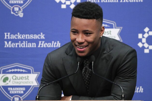 Running back Saquon Barkley answers questions during a news conference, Saturday, April 28, 2018, in East Rutherford, N.J. Barkley was selected as the number two overall pick in the NFL football draft by the New York Giants. (AP Photo/Julie Jacobson)