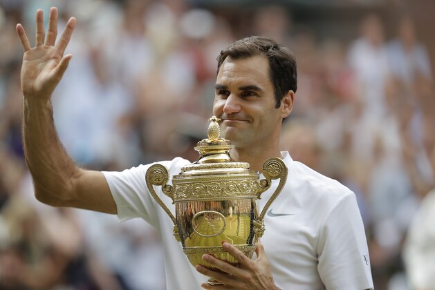 LONDON,UNITED KINGDOM - JULY 16:   Roger Federer parades the trophy after winning the men's singles final against Marin Cilic on Centre Court on day thirteen of the 2017 Wimbledon tennis championships at the All England Lawn Tennis Club on July 16th 2017 in London (Photo by Tom Jenkins/Getty Images)