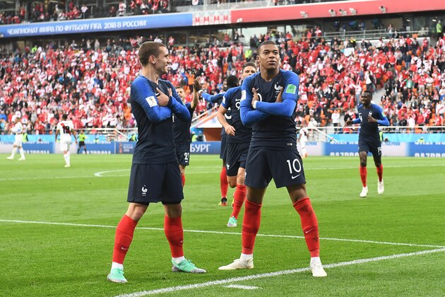 TOPSHOT - France's forward Kylian Mbappe (R) celebrates scoring the opening goal with his teammate forward Antoine Griezmann during the Russia 2018 World Cup Group C football match between France and Peru at the Ekaterinburg Arena in Ekaterinburg on June 21, 2018. (Photo by Anne-Christine POUJOULAT / AFP) / RESTRICTED TO EDITORIAL USE - NO MOBILE PUSH ALERTS/DOWNLOADS        (Photo credit should read ANNE-CHRISTINE POUJOULAT/AFP/Getty Images)