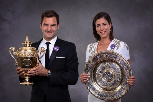 LONDON, ENGLAND - JULY 16:   (EDITORS NOTE: This image has been retouched.) (EDITORIAL USE ONLY - NO COMMERCIAL USAGE) Roger Federer and Garbine Muguruza pose with their trophies at the Wimbledon Winners Dinner at The Guildhall on July 16, 2017 in London, England.  (Photo by AELTC - Pool / Getty Images)