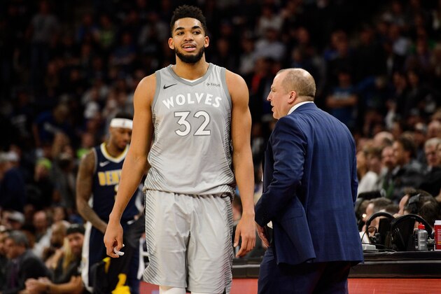 MINNEAPOLIS, MN - APRIL 11: Karl-Anthony Towns #32 of the Minnesota Timberwolves walks past head coach Tom Thibodeau on his way to the bench during the game against the Denver Nuggets on April 11, 2018 at the Target Center in Minneapolis, Minnesota. The Timberwolves defeated the Nuggets 112-106. NOTE TO USER: User expressly acknowledges and agrees that, by downloading and or using this Photograph, user is consenting to the terms and conditions of the Getty Images License Agreement. (Photo by Hannah Foslien/Getty Images)