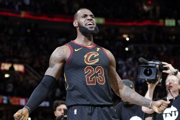 Cleveland Cavaliers' LeBron James reacts after making the game-winning shot in the second half of Game 5 of an NBA basketball first-round playoff series against the Indiana Pacers, Wednesday, April 25, 2018, in Cleveland. The Cavaliers won 98-95. (AP Photo/Tony Dejak)