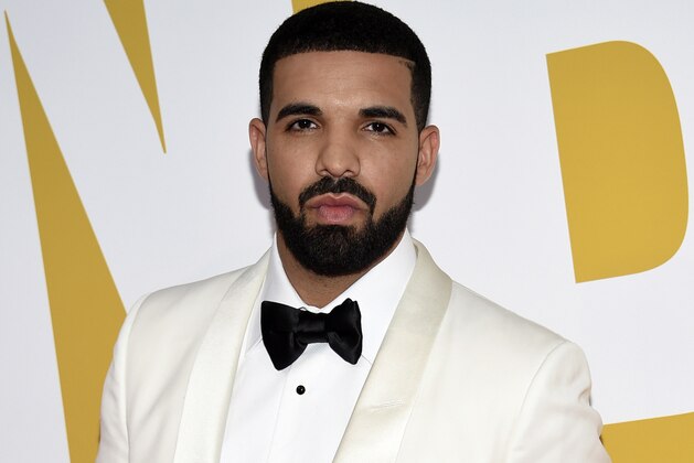 FILE - In this June 26, 2017, file photo, Canadian rapper Drake arrives at the NBA Awards in New York. Drake is going on tour. He announced the Aubrey and The Three Amigos tour on Monday, May 14, 2018. Drake will be joined by “Walk It Talk It” collaborators Migos and special guests on the North American leg through the summer and fall. (Photo by Evan Agostini/Invision/AP, File)