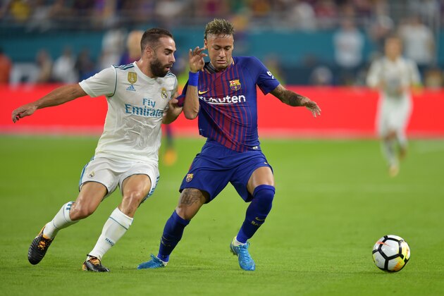 Neymar (R) of Barcelona vies for the ball with Daniel Carvajal(L) of Real Madrid during their International Champions Cup football match at Hard Rock Stadium on July 29, 2017 in Miami, Florida. / AFP PHOTO / HECTOR RETAMAL        (Photo credit should read HECTOR RETAMAL/AFP/Getty Images)
