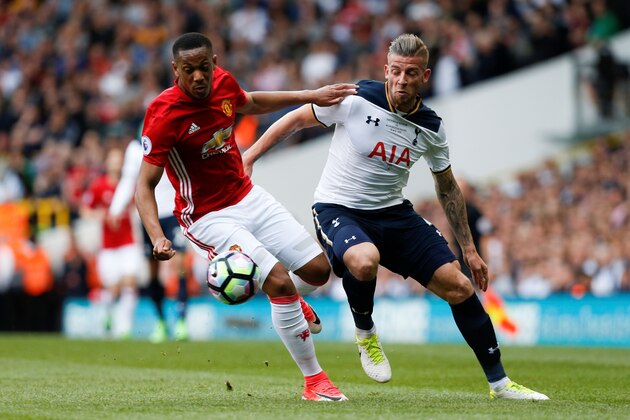 Manchester United's French striker Anthony Martial (L) vies with Tottenham Hotspur's Belgian defender Toby Alderweireld during the English Premier League football match between Tottenham Hotspur and Manchester United at White Hart Lane in London, on May 14, 2017. / AFP PHOTO / IKIMAGES / Ian KINGTON / RESTRICTED TO EDITORIAL USE. No use with unauthorized audio, video, data, fixture lists, club/league logos or 'live' services. Online in-match use limited to 45 images, no video emulation. No use in betting, games or single club/league/player publications.        (Photo credit should read IAN KINGTON/AFP/Getty Images)