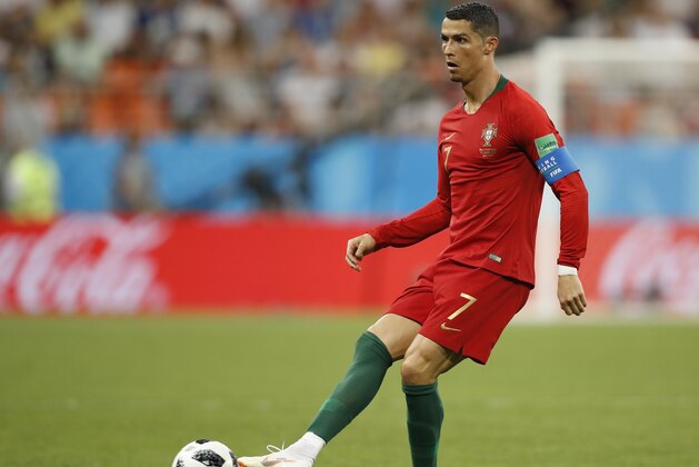 Portugal's Cristiano Ronaldo passes the ball during the group B match between Iran and Portugal at the 2018 soccer World Cup at the Mordovia Arena in Saransk, Russia, Monday, June 25, 2018. (AP Photo/Francisco Seco)