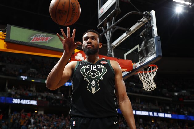 Milwaukee Bucks forward Jabari Parker (12) in the second half overtime of an NBA basketball game Sunday, April 1, 2018, in Denver. The Nuggets won 128-125 in overtime. (AP Photo/David Zalubowski)