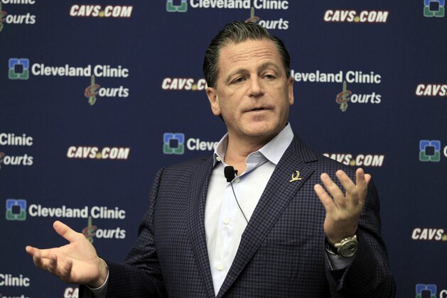 FILE - In this May 9, 2012 file photo, Cleveland Cavaliers owner Dan Gilbert  answers questions during a news conference at the team's training facility in Independence, Ohio. As Cavaliers fans breathlessly await a homecoming they never thought possible, the broken relationship between LeBron James and Dan Gilbert could get in the way.  (AP Photo/Tony Dejak)