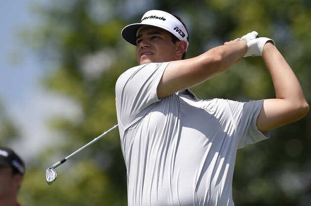 Beau Hossler watches his tee shot on the 17th tee during the second round of the Quicken Loans National golf tournament, Friday, June 29, 2018, in Potomac, Md. (AP Photo/Nick Wass)