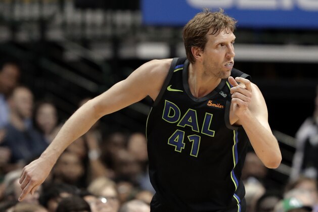 Dallas Mavericks' Dirk Nowitzki (41) celebrates sinking a 3-point basket in the second half of an NBA basketball game against the Portland Trail Blazers in Dallas, Tuesday, April 3, 2018. (AP Photo/Tony Gutierrez)