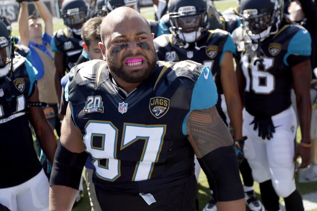 Jacksonville Jaguars defensive tackle Roy Miller (97) talks to his teammates during pre-game warm ups before the start of an NFL football game against the Cleveland Browns, Sunday, Oct. 19, 2014, in Jacksonville, Fla. The Jaguars beat the Browns 24-6. (AP Photo/Stephen B. Morton)