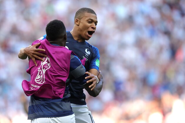 KAZAN, RUSSIA - JUNE 30:  Kylian Mbappe of France celebrates with teammate Ousmane Dembele after scoring his team's fourth goal during the 2018 FIFA World Cup Russia Round of 16 match between France and Argentina at Kazan Arena on June 30, 2018 in Kazan, Russia.  (Photo by Alexander Hassenstein/Getty Images)